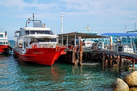 At Don Sak Pier, where the cerulean sea meets the sky, anticipation hangs in the salty breeze.