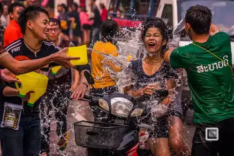 Who's up for a water fight at Luang Prabang's New Year celebration? Don't forget your raincoat!